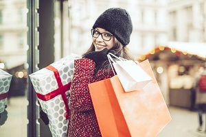 Woman Smiling with Shopping Bags